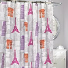 a shower curtain with the eiffel tower in pink and orange on it's side