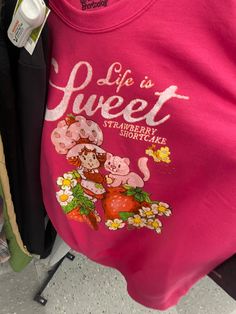 a pink shirt that says life is sweet strawberry shortcakes on the front and back