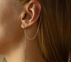 Introducing our Gold Cuff Chain Earrings, the perfect accessory for those who love a touch of elegance and minimalism. Crafted with care, these ear cuffs feature a stunning gold plated 14K finish that exudes a radiant glow. No piercing required - these cuffs simply slide onto your earlobe, adding a unique and stylish charm. With a delicate and versatile chain design, they effortlessly thread through your ear, enhancing your look with a subtle and sophisticated touch. Perfect for everyday wear or Minimalist Tarnish Resistant Ear Climbers For Everyday, Dainty Yellow Gold Ear Cuff For Everyday, Everyday Minimalist 14k Gold Ear Cuff, Elegant Everyday Cartilage Earrings With Adjustable Chain, Minimalist Pierced Yellow Gold Ear Cuff, Gold Minimalist Ear Cuff With Adjustable Chain, Minimalist Dangle Ear Cuff For Everyday, Minimalist Everyday Dangle Ear Cuff, Everyday Minimalist Dangle Ear Cuff