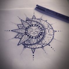 a drawing of a sun with a face on it's side, sitting next to a pen