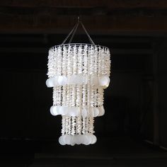 a white chandelier hanging from a ceiling