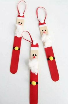 three santa claus pencils made out of paper