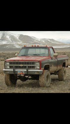 an old pick up truck in the middle of nowhere