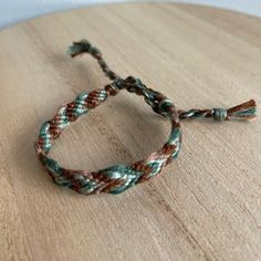 a close up of a rope on top of a wooden table