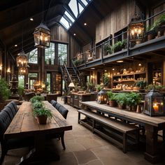 an indoor dining area with wooden tables, benches and potted plants in the center