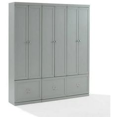 a large gray cabinet with four doors and two drawers on the bottom, in front of a white background