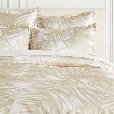 an image of a bed with palm leaves on it