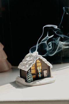 Dreaming of cosy nights by the log fire in Aspen. The classic ski cabin features a green tree, a pair of skis and a snowy scene. Lift off the top and put in a cone incense burner under the chimney for a burning log fire and smokey chimney. Select to add 2 x incense cones. Insence Burner, Log Fire, Ski Cabin, Chalet Design, Snowy Scene, Cone Incense, Ski Gifts, Incense Cone, Log Fires