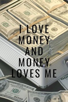 the words i love money and money loves me on top of stacks of hundred dollar bills