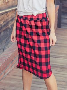 Looking for a weekend skirt that's both cozy and stylish? Look no further than our Buffalo Plaid Weekend Skirt! This skirt is the perfect combination of cute and comfortable, with a knee-length cut and a self-tie waistband that'll keep you feeling feminine and put-together all day long. Whether you're running errands or meeting up with friends for brunch, this skirt is sure to turn heads. And with sizing options ranging from S to 3X, it's easy to find the perfect fit for your body type.So why wa Fall Daywear Skirted Bottoms, Casual Fall Midi Skirt, Casual Midi Skirt For Fall, Fall Day Out Pencil Skirt, Fall Mini Skirt With Elastic Waistband, Fall Pencil Skirt For Day Out, Midi Skirt For Daywear In Fall, Casual Gathered Skirt For Fall, Casual Cotton Pencil Skirt For Day Out