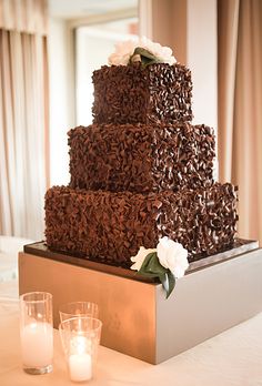 a large chocolate cake sitting on top of a table