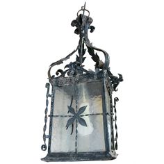 an old fashioned lantern hanging from a chain on a white background with clippings