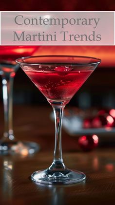 two martini glasses filled with red liquid and the words contemporary martini trend in front of them