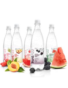 five bottles of water with fruit on the side