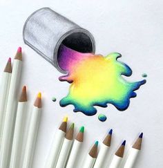 some colored pencils are laying next to a paint can and crayons on the paper