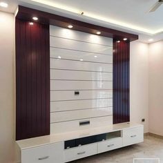 an empty living room with white and brown furniture