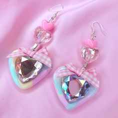 Was £26 ~ Now £20 Pastel rainbow clay heart earrings with iridescent heart beads and pink gingham bows Earring drop: 7.5cm Heart charm size : 3.5 x 4cm Handmade with love in the UK Cute Multicolor Jewelry With Heart Charm, Cute Iridescent Jewelry For Parties, Cute Iridescent Jewelry For Gift, Cute Multicolor Jewelry For Valentine's Day, Cute Pastel Jewelry For Gifts, Cute Pastel Jewelry For Gift, Fun Pastel Colored Jewelry For Gifts, Handmade Sweet Heart Earrings, Whimsical Pastel Jewelry As Gift