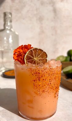 a drink with orange garnish on the rim