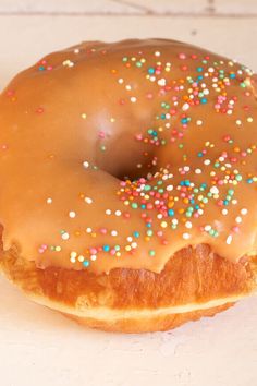 a glazed doughnut with sprinkles on it