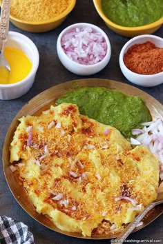 an omelet with onions, spinach and other ingredients on a table top