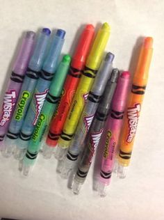 several pens are lined up in a row