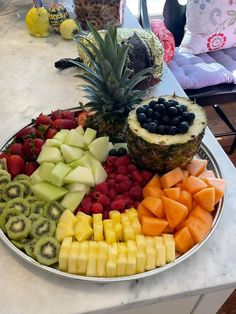 a platter filled with different types of fruit