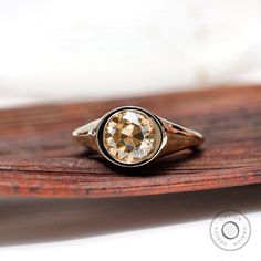 8 MM Light Champagne Old European Cut Moissanite Ring, 14K Solid Gold Signet Ring, Unique Promise Rings For Women, Vintage Statement Ring, gold signet ring, signet ring women, 14k gold signet ring, bezel ring, Round Solitaire Ring, OEC Moissanite Ring, vintage wedding ring, chunky ring, antique signet ring, moissanite signet ring ✣ 𝐌𝐞𝐭𝐚𝐥𝐬 ✣ ー Available in Argentium Silver | White Gold | Yellow Gold | Rose Gold ー Available in 10K | 14K | 18K Gold ✣ 𝐂𝐞𝐧𝐭𝐫𝐞 𝐒𝐭𝐨𝐧𝐞 𝐃𝐞𝐭𝐚𝐢𝐥𝐬 ✣ ー Type: Moissanite ー Shape: Old European cut 8 mm (1 Pcs)  ー Weight: 1.860CT ー Color: Champagne  ー Clarity: VVS ✣ 𝐑𝐢𝐧𝐠 𝐃𝐞𝐭𝐚𝐢𝐥𝐬 ✣ ー Solid Silver/Gold ーBand Width: 2.25 MM ー Band Thickness:  1.70 MM ー [Ring specs can be customized as per your liking] ー Design No: ER11106 ✣ 𝗖𝘂𝘀𝘁𝗼𝗺𝗶𝘇𝗮 Champagne Moissanite Ring, Signet Engagement Rings, 14k Gold Signet Ring, Round Solitaire Rings, Unique Promise Rings, Signet Rings Women, Ring Bezel, Chunky Ring, Round Solitaire