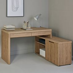 a wooden desk with two drawers and a lamp on the top shelf next to it