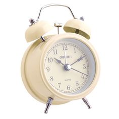 an old fashioned alarm clock on a white background