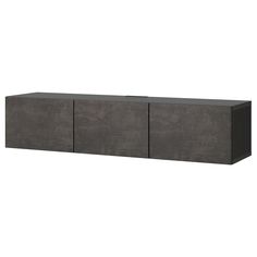 the sideboard is made out of concrete and has three doors on each side,