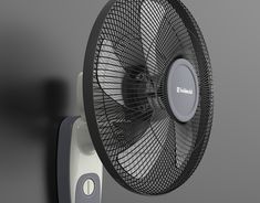 a black and white wall mounted fan next to a gray wall with the word bleacher on it