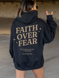 FREE shipping in the US! No order minimum.  Faith Over Fear Hoodie, Christian Hoodies, Christian Sweatshirt, Jesus Hoodie, Trendy Hoodie, Bible Verse Hoodie, Bible Verse Shirt ♥ The HOODIE * This is a Gildan 18500 heavy blend adult hooded sweatshirt (unisex).  * Detailed sizing information can be found in the size chart in the photos. * Printed in the USA. ♥ CARE ＊Machine wash cold, inside-out, gentle cycle ＊Wash with mild detergent and similar colors ＊Tumble dry low or hang-dry ＊Do not bleach or fabric softeners ＊Do not iron directly onto the design ＊Do not dry clean ♥ PRODUCTION & SHIPPING ＊Each sweatshirt is made to order. ＊Production time : 2-7 business days (Excluding weekends, holidays) ＊US Shipping time : 3-6 business days ＊Most US customers received the order within 5-10 days of th Jesus Clothes, Christian Shirts Designs, Christian Hoodies, Christian Quotes God, Bible Verse Shirt, Christian Sweatshirt, Faith Over Fear, Christian Quotes Inspirational, Christian Clothing