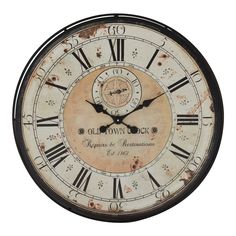 an old clock with roman numerals on the face and numbers in black frame