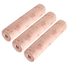 three rolls of pink floral wrapping paper