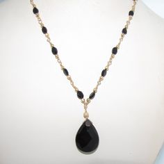 16.75" Black Agate And Onyx Necklace With Gold Filled Wire Wrapped Chain This Particular Piece Is Approximately 16.75" And Features A Toggle Clasp. The Faceted, Tear-Shaped, Polished Pendant Is Onyx And Drops Approximately 1.25" Below The Base Of The Necklace. The Faceted, Oval-Shaped Stones Are Black Agate And Are Delicately Intertwined Into The Handmade Chain Alongside Gold-Filled Beads To Add To The Richness And Elegance Of The Necklace. Black And Gold Are Timeless Colors In Jewelry But They Wire Wrapped Chain, Handmade Chain, Black Onyx Necklace, Black Bead Necklace, Bohemian Art, Onyx Necklace, Black Agate, Black Necklace, Necklace Black