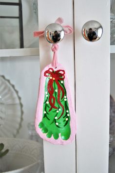 the door handle is decorated with an image of a christmas stocking hanging from it