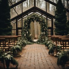 an outdoor ceremony with greenery and candles