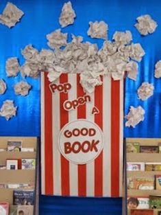 an image of a popcorn book display with paper flowers in the center and books on the shelves