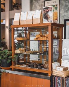 a bakery display case filled with lots of pastries