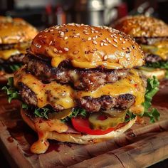 two cheeseburgers are sitting on a cutting board