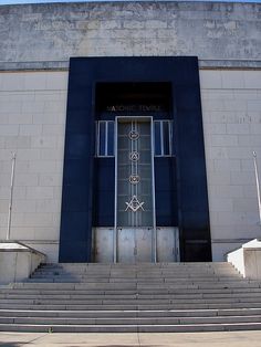 an entrance to a building with steps leading up to it