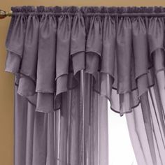 the curtains are hanging in front of the window