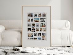 a white couch sitting next to a wall with pictures on it