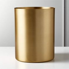 a gold cup sitting on top of a white counter