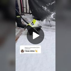 someone is cleaning the snow on their skis with a yellow and black handlebar