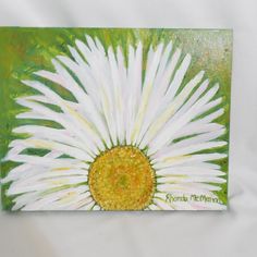 a painting of a white flower with yellow center