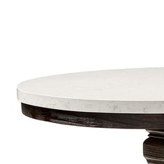 a white marble top coffee table with wooden base and black wood trim around the edge