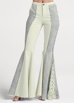 Crafted from authentic 100% cotton, our New Vintage Flare Jeans have a lived-in feel with non-stretch denim that gets more broken in with every wear. Dramatic with their wide flared legs, these railroad striped jeans put all eyes on you no matter where you're headed. The retro-inspired silhouette meets the feminine lace, finishing with frayed edges for casual-chic balance.  * 100% cotton  * Non-stretch fabric; size up one size for a more relaxed fit  * Available in plus size  * Mid rise  * 33” Inseam  * Lace detail at flared leg  * Railroad striping down side  * Zipper/button closure  * Side slit pockets  * Imported Haute Couture, Couture, Vintage Flare Jeans, Vintage Flare, Striped Jeans, Work Wear Women, All Eyes, Mode Vintage, Fashion Sale