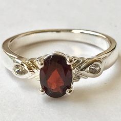 Silver Red Garnet Solitaire Cocktail Ring Dark Red Semi-Precious Garnet Stone. Made In Thailand. Dainty Styling Approximately 1 Carat Red Garnet Stone. 2 Clear Sparkly Aaa Grade Cubic Zirconias. Silver Plated Jewelers Brass Base Vintage Old Store Stock New Never Used. Comes In Sizes 6, 8 And 9. Red Stone Engagement Rings, Garnet Stone Ring, Garnet Wedding Rings, Garnet Ring Vintage, Garnet Wedding, Wedding Rings Art, Garnet Engagement Ring, Cute Engagement Rings, Semi Precious Stone