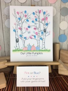 a card with the words pink or blue on it next to a sign that says our little pumpkin